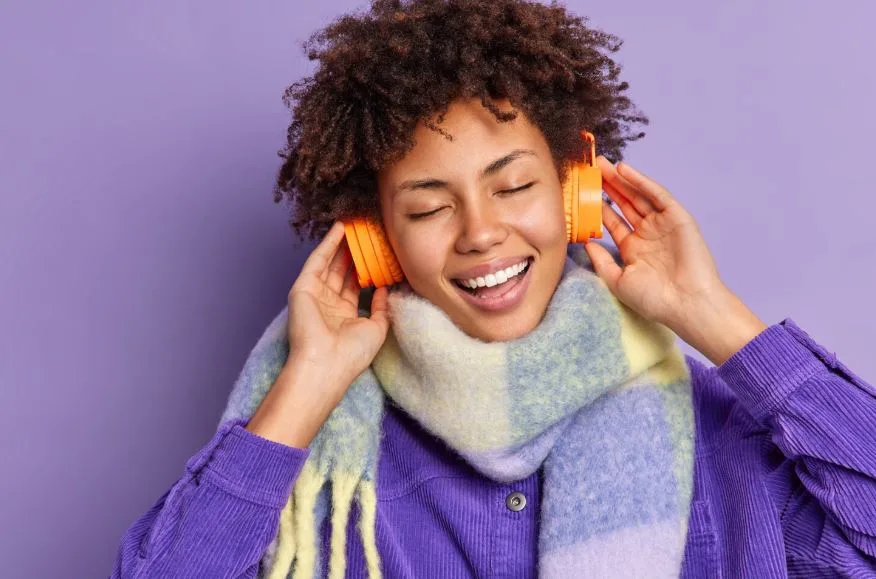 Reader enjoying an audiobook with headphones