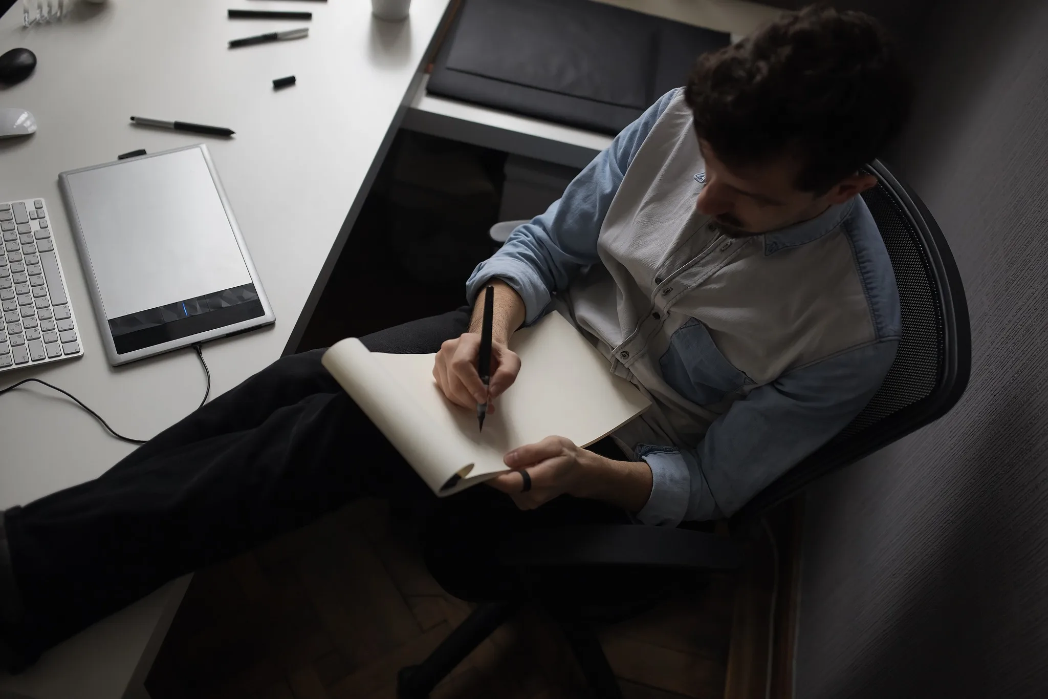 Ghostwriter developing manuscript notes at a desk