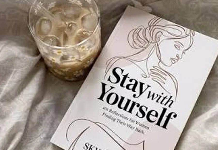 Stay with Yourself book beside a drink