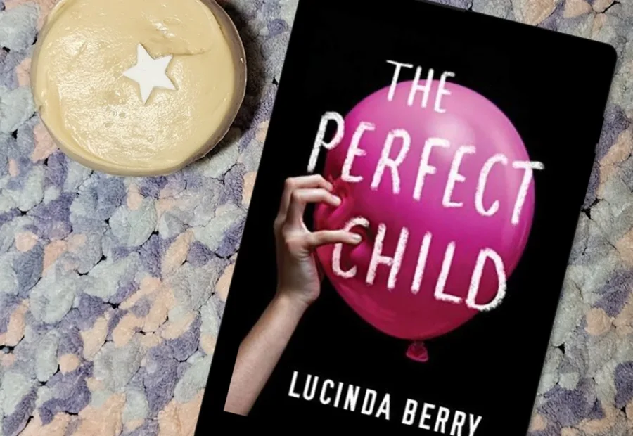 The Perfect Child book beside a candle